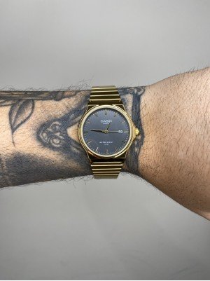 CASIO QUARTZ REDONDO DOURADO FUNDO PRETO